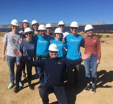 Cal Poly Wind Power team members pose for a photo with engineers in industry.